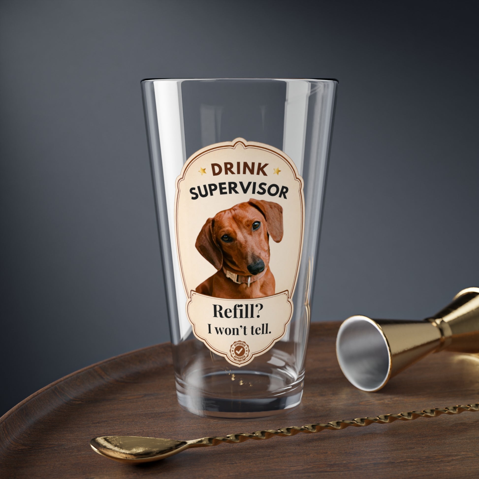 Custom pet mixing glass with Drink Supervisor dachshund design on a bar tray with jigger and spoon