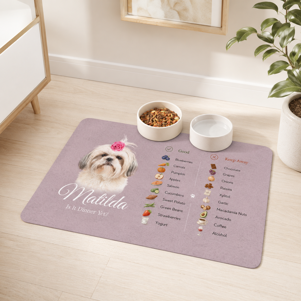Rose dog food mat with a safe foods guide on a light wood bedroom floor, with two ceramic bowls.