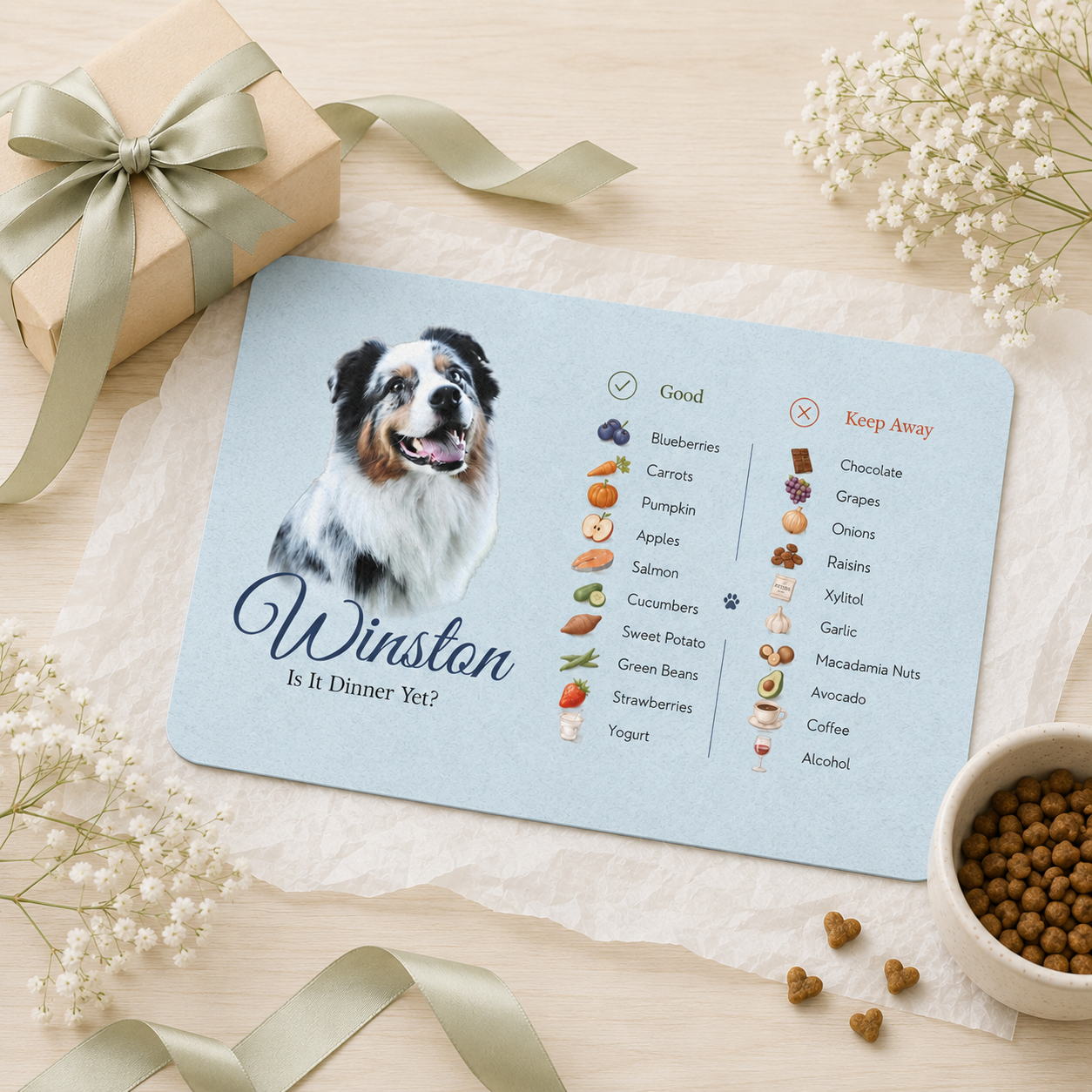 Personalized dog food mat styled as a gift with a kraft gift box, ribbon and baby's breath.