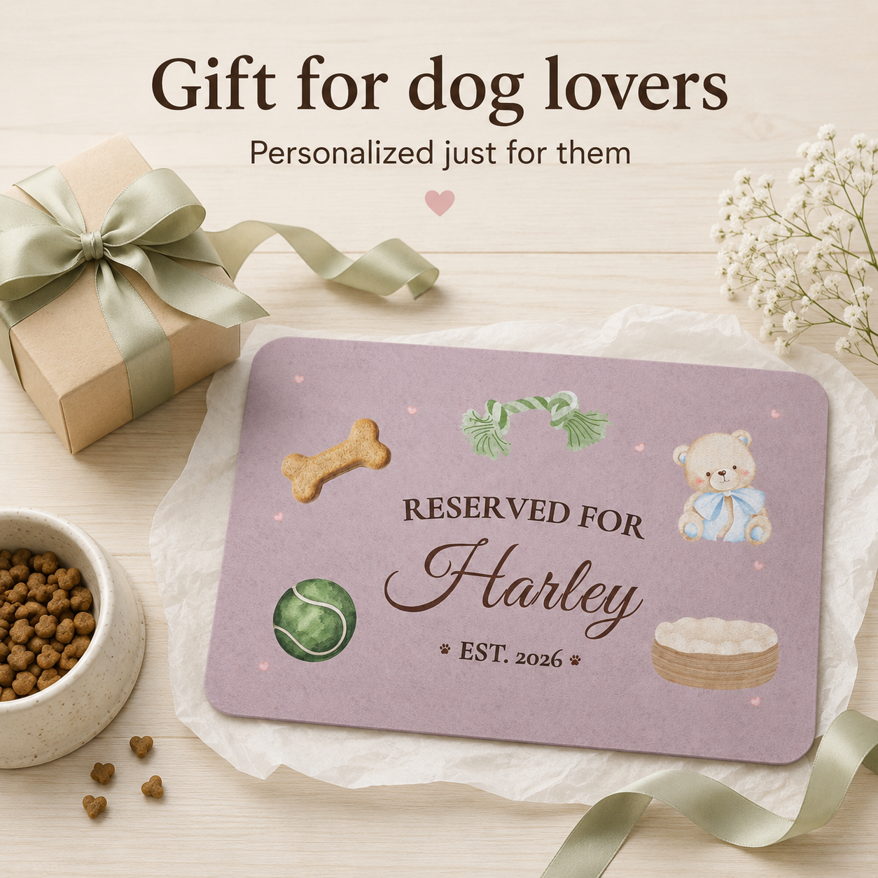Personalized dog mat gift wrapped near a kraft gift box, ribbon, and dog treats for Harley.