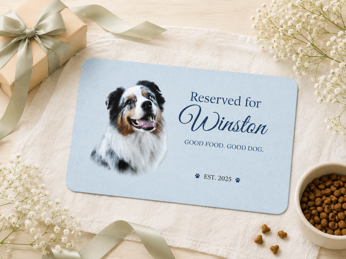 Personalized dog placemat styled as a gift with a kraft gift box, satin ribbon and baby's breath.