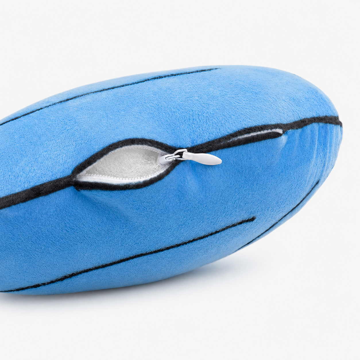 Close-up of a blue pillow's hidden zipper closure