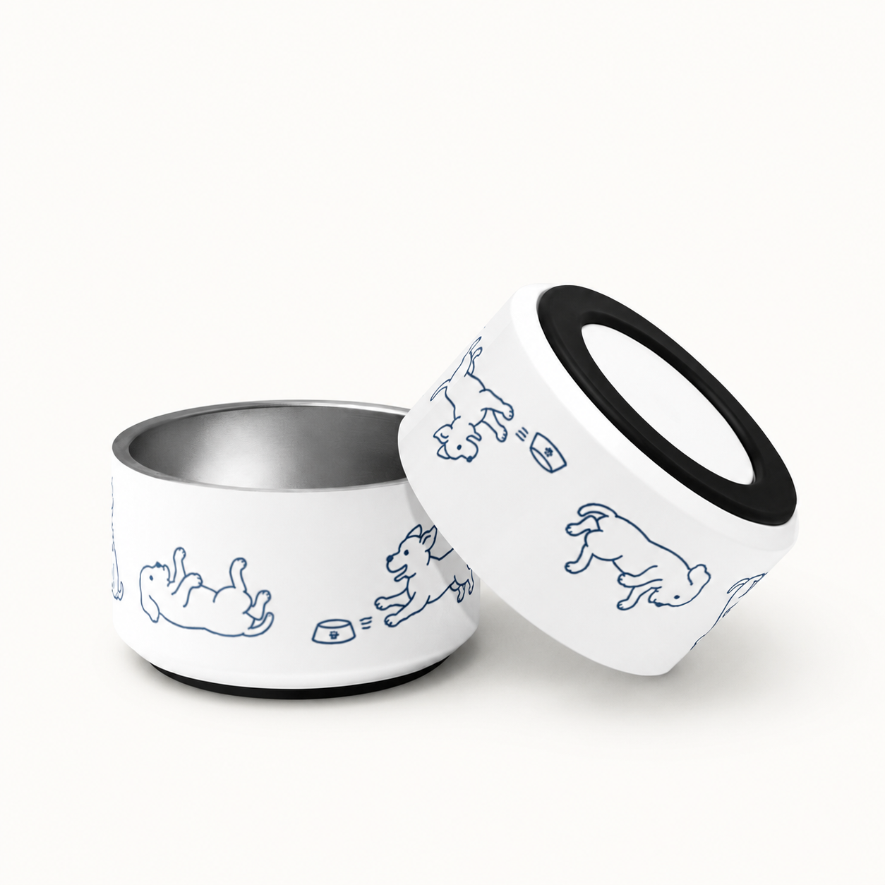 Two dog bowls, one tipped on its side, showing the removable anti-slip rubber base
