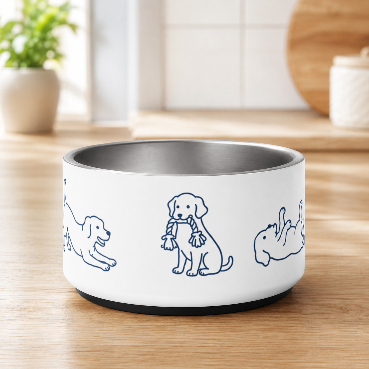 Empty stainless steel dog bowl with anti-slip base on a kitchen counter
